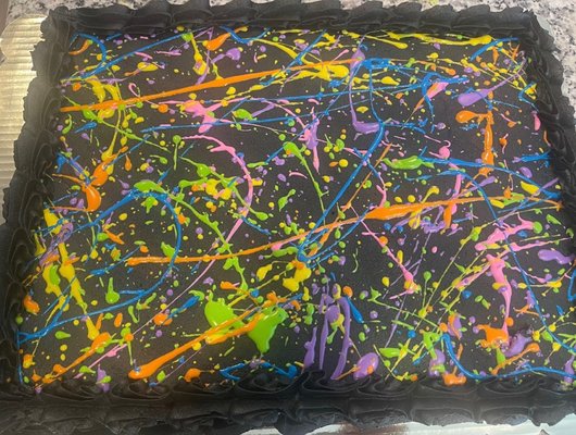 Neon splatter vanilla sheet cake, with black buttercream.