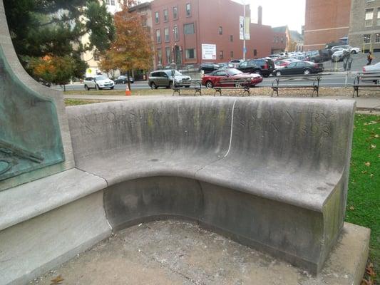 Bench with obscured and soiled dedication