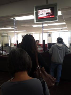 Only 2 bankers and long lines wait 40 minutes for simple deposit.