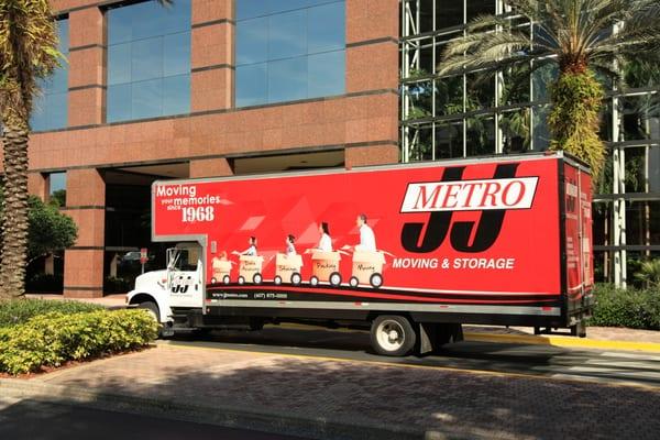 Picture of a J&J Metro Moving and Storage truck outside of office building during a move in Maitland, Florida.