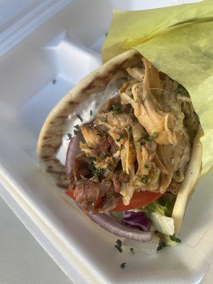 Döner Wrap. Lamb,Beef and Chicken on Pita Bread topped with Veggies and our Homemade Tzatziki Sauce. (Garlic Cucumber Sauce)