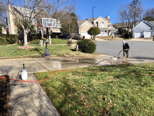 Cleaning the driveway.