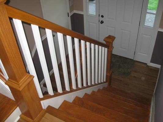 A new oak staircase makes this Marlboro NY entryway pop!