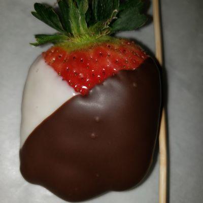 Freshly dipped tuxedo (white & dark chocolate) strawberry. Custom orders welcome!