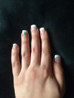 French manicure with gel polish. Teal/gold flower on ring finger.