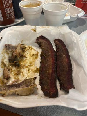 Brisket and cups of green beans and baked beans.