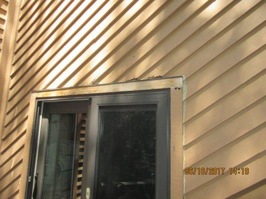 BEFORE: Wood rot is eliminated by replacing 5 angle boards and then the trim boards are wrapped in aluminum.