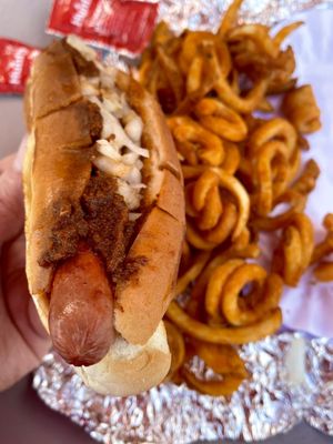 Chili cheese dog with onions and curly fries