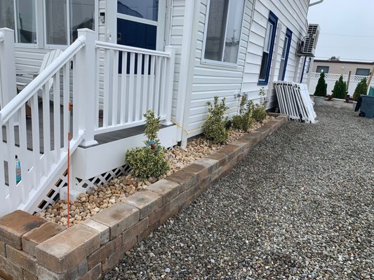 Retaining wall. Stone. Plants installed.