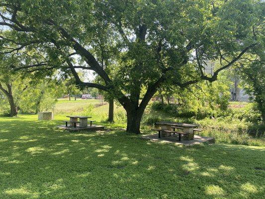 Picnic tables next to the park