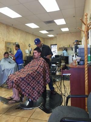 Carlos sporting his Signature Dodger Hat getting it done. Time for me to get my ears lowered.