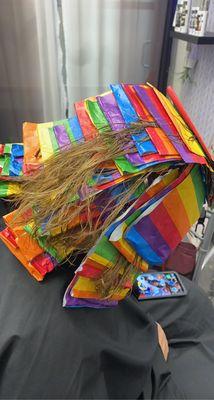 This is just a client of mine enjoying her time at my salon getting her hair foiled with rainbow foils for pride month.