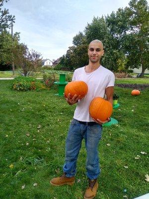 Pumpkins grown by BBGC Fall 2021. Here's a customer proud of his purchase