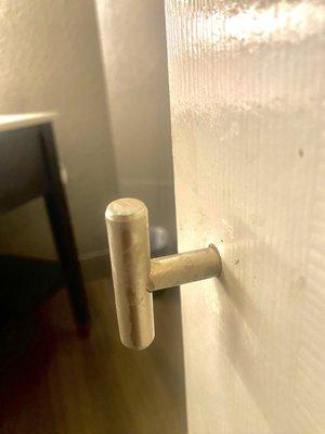 The rusty door handle