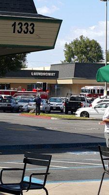 Hard to see but smoke was coming out of the laundromat note the fire trucks