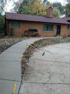 Sidewalk to entrance and driveway