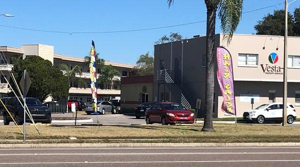 You can barely make out the barber pole between the 2 banners