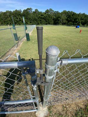 The gate latch- pull stick up (or push down?) then push gate forward