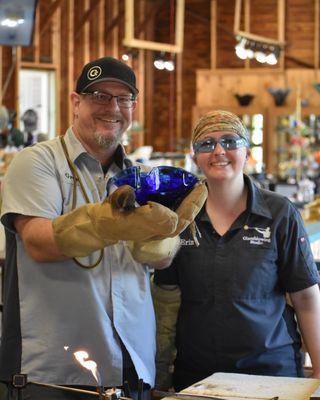 our two favorite instructors posing with a new demo bowl