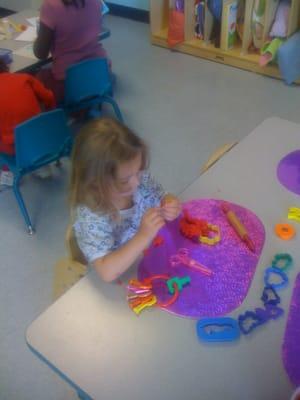 Play stations set-up around the room for children to choose from.