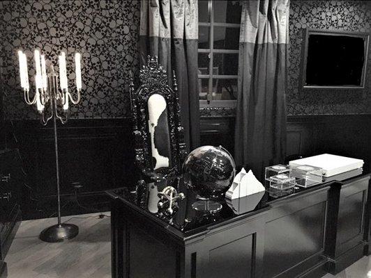 Young Entertainment Executive's office - Skull wallpaper, black lacquer and unique lighting - cool but professional.