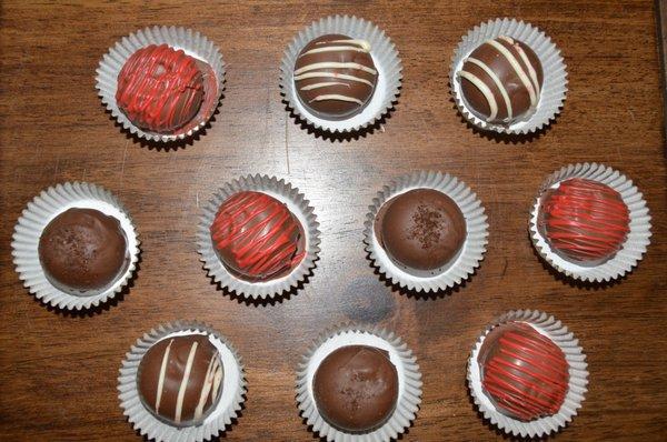 Custom Truffles. Made all by hand with a dark chocolate center and dipped in milk chocolate.