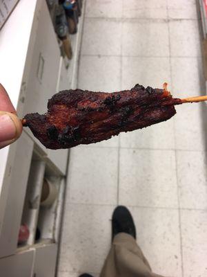 This is there chicken on a stick it's burned