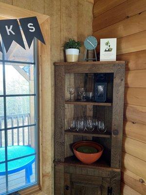 Corner shelves; looks built in Cabinet door below. We get lots of compliments on this piece!