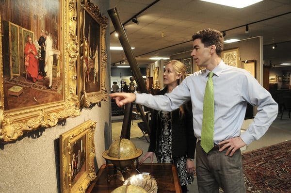 Company President and CEO, Andrew Brunk with Tennessee Director of Operations, Sarah Sperling viewing a painting in the gallery.