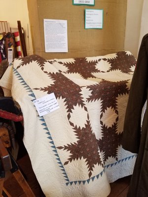 Quilt from theb1800's on display in the Old Town Hall during Maple Festival.