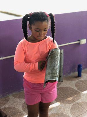 Learning Jamaican rhythm using a kitchen grater and a fork