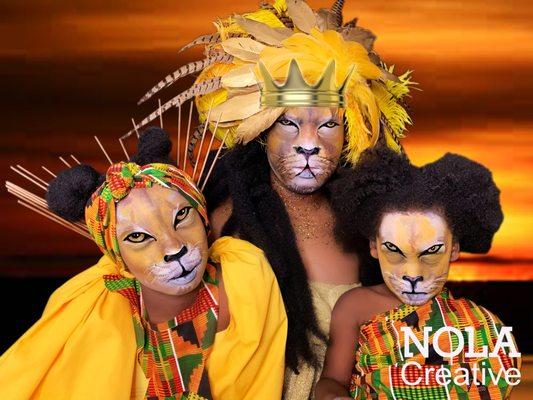 Lion Queen and her cubs a tribute to The Lion King! This is face paint on all people in the photograph! The background is Photoshopped!