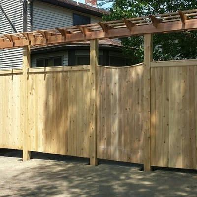 Cedar board privacy fence with a pergolas on top. Gloucester MA.