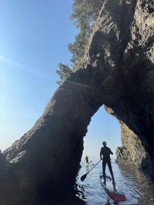 Deception Pass SUP class exploring a sea cave.