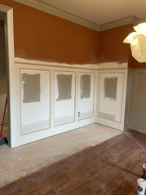 Matching existing wainscoting design in dining room after pipe bursted, ruining the design that was previously in the space.