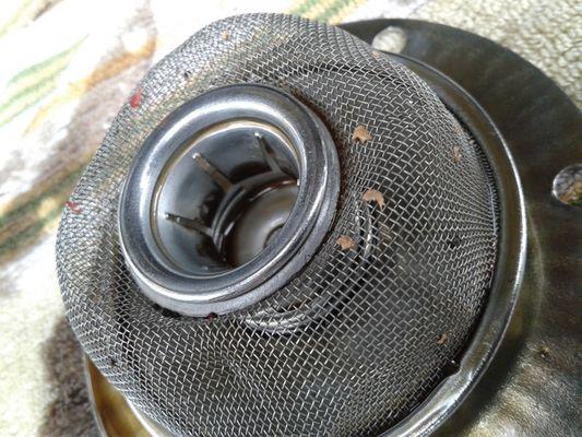 sealant found in oil strainer due to botched oil pump install by Wayne, little to no sealant should be used