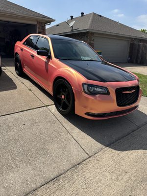 gloss coral peach installed with gloss black accents with gloss black roof and hood