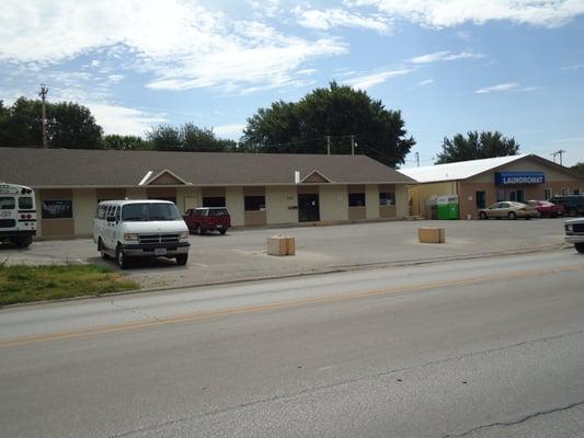 The building is next to the Laundromat.