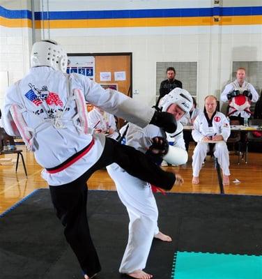 Here are guy "Mike" is in a TaeKwonDo tournament, but using shin from Muay Thai vs foot only used in TaeKwonDo kicks 95% of t...