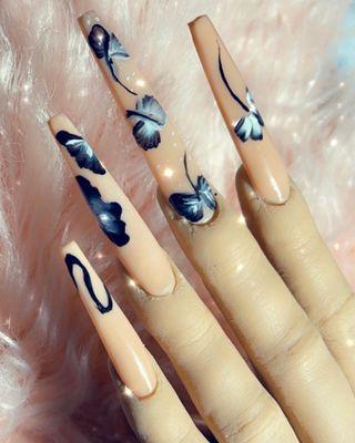 Long, coffin nail with hand painted nail art.