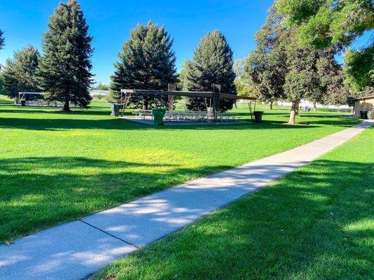 Several, covered picnic tables for gatherings. Lots of shade!