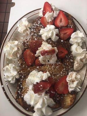 Strawberry Cinnamon French Toast with whip cream and powdered sugar!