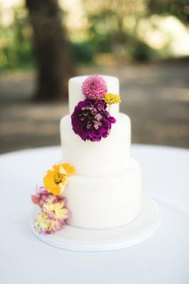 Our florist provided the flowers, and Krista arranged them on the cake, on-site.