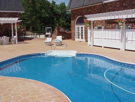 Pool deck area outlined in stone and brick design