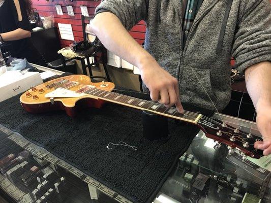 Joseph J. restringing my new Epiphone Les Paul before I buy it. This guy knows his stuff and his kindness & professionalism is outstanding!