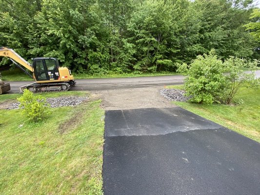 View from the driveway. The 8 inch pipe more than 20" deep to avoid potential frost heave damage.