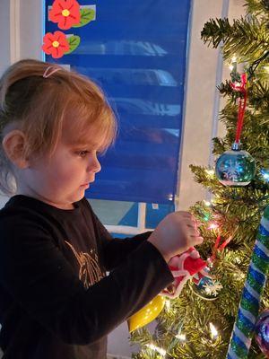 Decorating The Christmas tree with self made ornaments