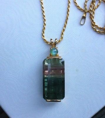 I brought this 24 Ct. Tourmaline and 0.8 ct. Chrysoberyl Cat's Eye to Jim and He made this beautiful Pendant for me.