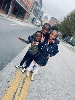 My kids outside the shop while we wait on our services to be done