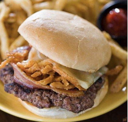 Delicious cheeseburger with lettuce, tomato, pickles, mayo ketchup with fries.